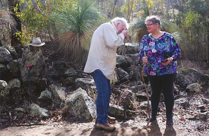 A man and a woman surveying the surrounding environment